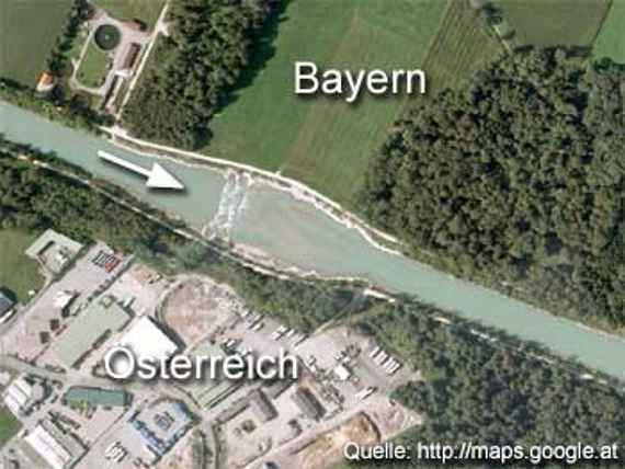 Aerial photo: Final state after completion of construction on the border between Austria and Bavaria (Germany). A drawn arrow shows the direction of flow of the water.