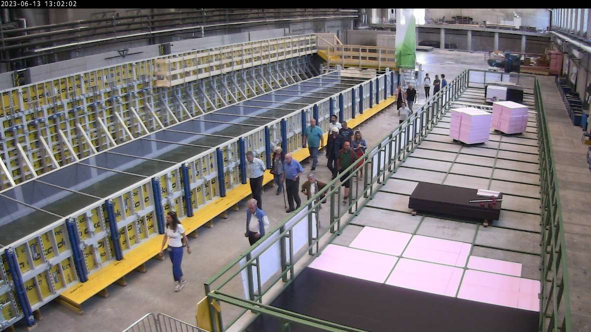 View from the webcam into the Main Channel. Between the experimental channels is a crowd of people taking part in an open house tour.